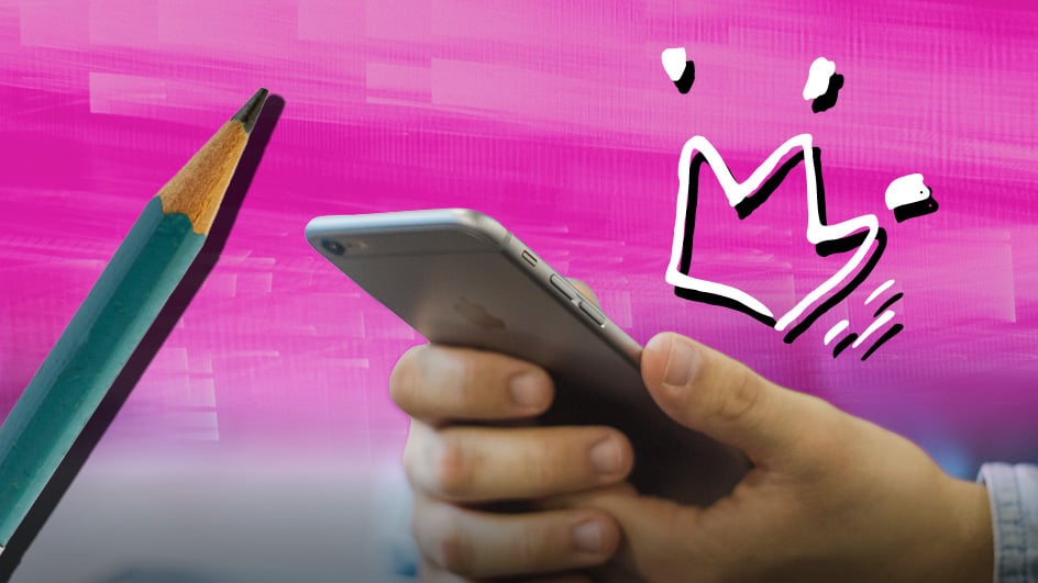 A hand holding a smartphone next to a green pencil, with a pink background and a white abstract crown-like doodle—an inspiring setup for boosting study skills.