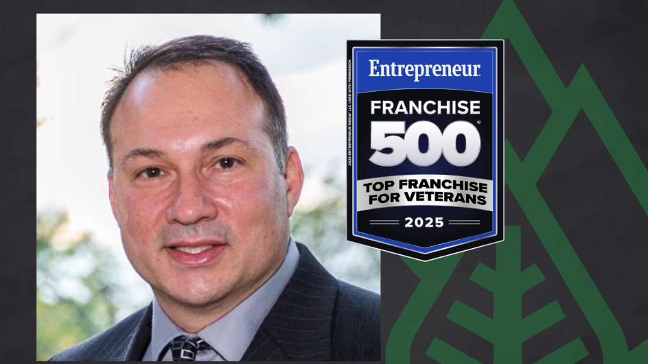 A man in a suit and tie is smiling in a portrait beside a badge that reads, Entrepreneur Franchise 500 Top Franchise for Veterans 2025, against a dark background with a green leaf pattern.