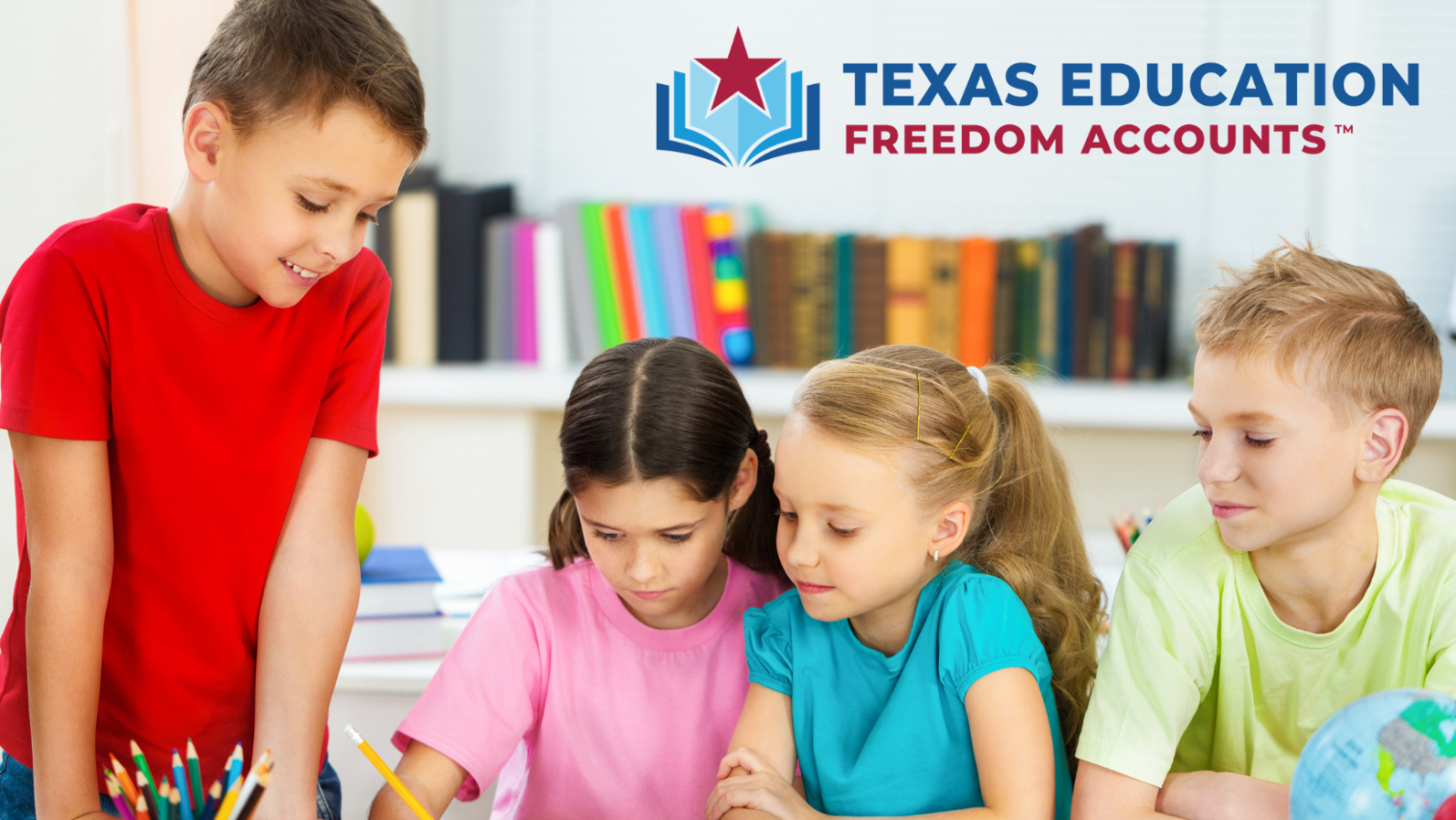 Four children are gathered together at a desk in a classroom, looking at papers and writing. The background features shelves with books. The Texas Education Freedom Accounts logo is displayed in the upper right corner.